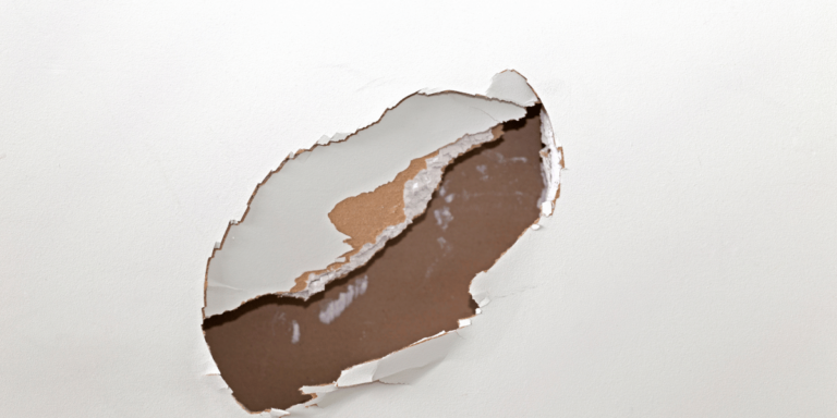 closeup of a hole in drywall