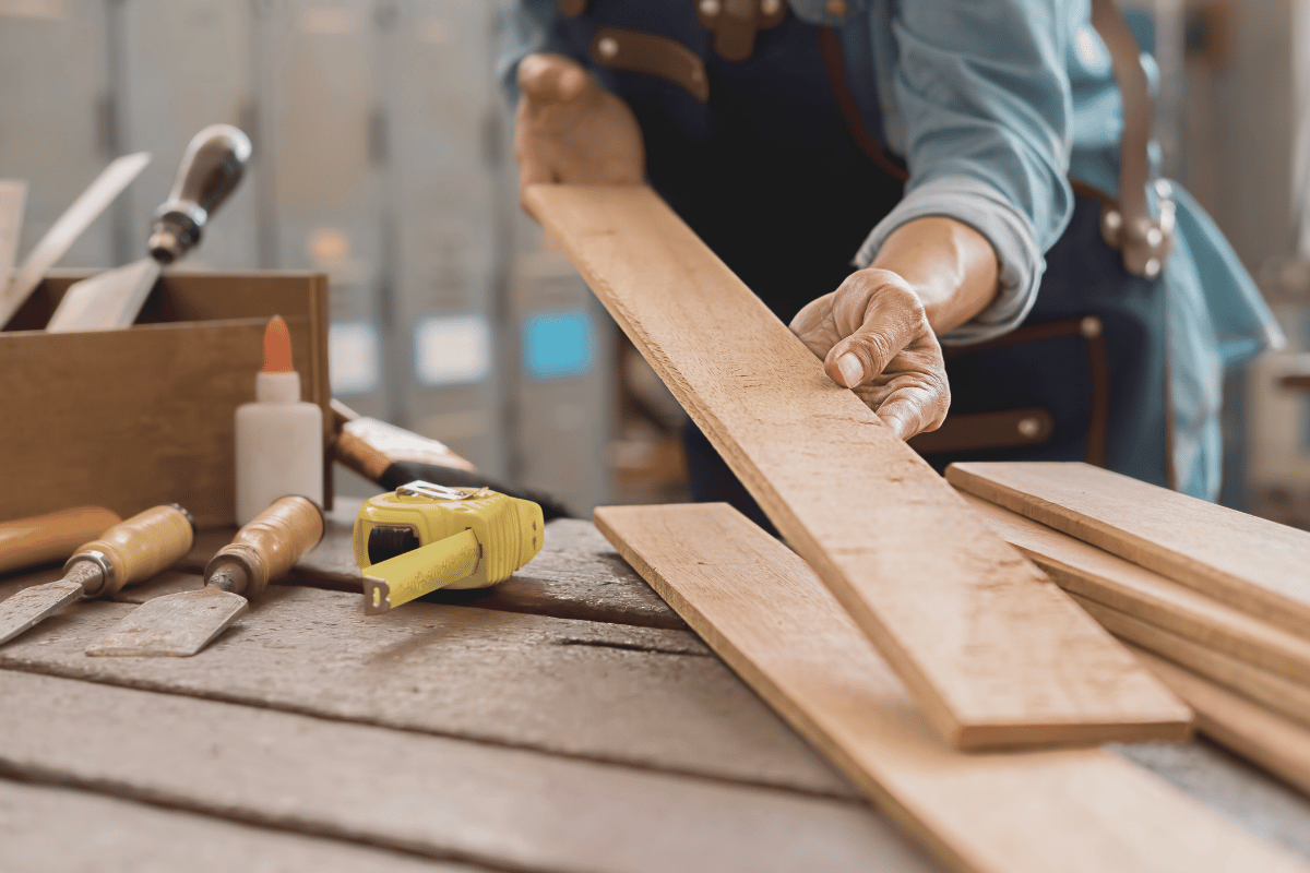 closeup of a woodworker laying out lumber